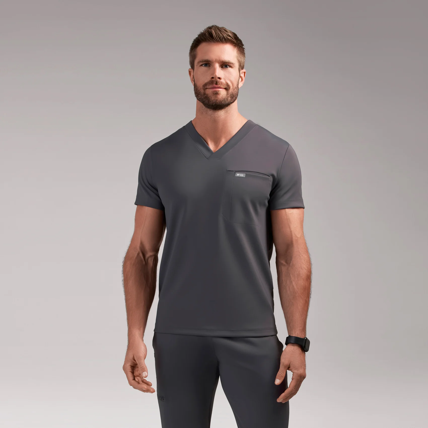 8121-men-s-charcoal-logan-formx-slim-v-neck-scrub-toptm-1.webp men's Charcoal Logan FORMx Slim V-Neck - Scrub Top™